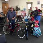 Pictured with some of the items donated for auction, from left, are Jerry Raines, Lonnie Wild and Bill Simpson. (Photo by Colleen Simpson)