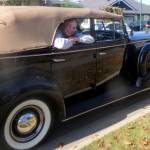 Scott Larsen (as President Franklin D. Roosevelt) waves from a 1936 McLoughlin Buick Roadmaster Phaeton &mdash; the same model FDR rode in during his three-hour visit to Victoria, British Columbia, 80 years ago. (Scott Larsen photo collection)
