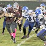 Hoquiam&rsquo;s Sean McAllister runs the ball during the Grizzlies&rsquo; 35-14 victory over Elma on Friday night at Olympic Stadium. (Brendan Carl photography)