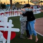 An Illinois man drove all night to deliver homemade wooden crosses bearing the names of those killed during the mass shooting. They have been placed off Las Vegas Boulevard. (Gina Ferazzi | Los Angeles Times)
