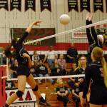 Photo by Bob Hitt &mdash; Raymond&rsquo;s Tina Sypaphay, left, spikes against defensive pressure by Ocosta&rsquo;s Kaylee Barnum on Monday night.
