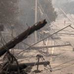 Power poles and lines block a street at Brookdale and Aaron Drive in Hidden Valley, where most of the homes were destroyed by fire, on October 9, 2017, in Santa Rosa, Calif. (Brian van der Brug/Los Angeles Times)