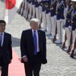 Kiyoshi Ota | Bloomberg                                 Japanese Prime Minister Shinzo Abe and President Donald Trump walk past an honor guard at Akasaka Palace in Tokyo on Monday.