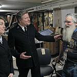 Lt. Claire Hawk-O&rsquo;Brien and Lt. Lincoln Hawk, center, discuss the store&rsquo;s inventory with Salvation Army employee Gilbert Newman.