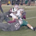 Montesanos Brennen Wolcott, Kooper Karaffa (23) and Kai Olson (55) wrap up Charles Wrights Anthony Lunberg on Friday night. (Brendan Carl Photography)