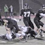 Hasani Grayson | The Daily World                                Hoquiam defensive lineman Matt Brown sacks Meridian quarterback Simon Burkett in the second quarter on Saturday night.