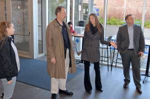 While visiting his alma mater Grays Harbor College, U.S. Ambassador Allan Mustard listens to Lisa J. Smith, the Director of College Development, explain recent developments at John Spellman Library. (Photo by Louis Krauss)