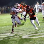 (Photo by Larry Bale) Peter Hamilton finds some running room at midfield. He gained 96 yards on 21 carries.