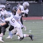 (Hasani Grayson | The Daily World) Carson Klinger fights forward for extra yardage against Meridian.