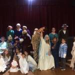 Courtesy photo                                 Cora Dooley, who plays one of the rowdy Herdman children in the Grayland Players production of The Best Christmas Pageant Ever, holds up the baby Jesus in triumph.