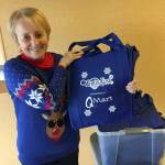 The first 200 visitors to the Winterfest Market on Friday will receive a free commemorative shopping bag, shown by event co-organizer Bobbi McCracken. (Kat Bryant | The Daily World)