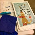 A table is stacked with materials for the Winterfest Market as the organizers set up the space on Wednesday. (Kat Bryant | The Daily World)