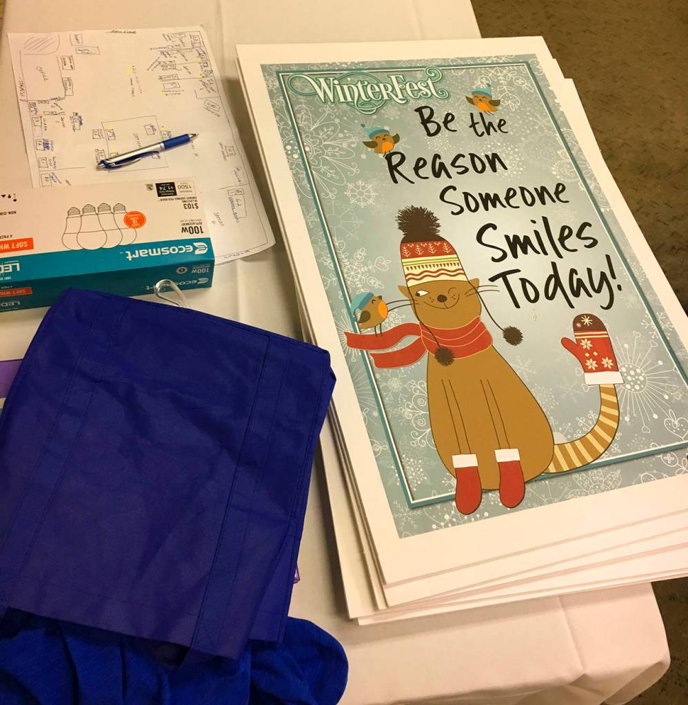 A table is stacked with materials for the Winterfest Market as the organizers set up the space on Wednesday. (Kat Bryant | The Daily World)