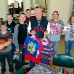 Scott D. Johnston | For twin harbors Newspaper Group                                 Santa Joe Cornell is popular with the kids as he brings Christmas cheer to 23 schools throughout Grays Harbor County. Last Friday, he brought a carload of new toys, clothes and school supplies to Ocean Shores Elementary School.