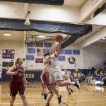 Aberdeens Reagan Glanz splits between Hoquiam defenders on her way to the basket on Thursday night. (Brendan Carl Photography)