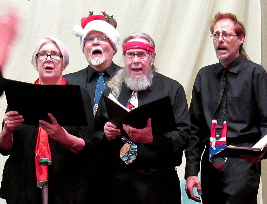 Scott D. Johnston | For Twin Harbors Newspaper Group                                Karin West, Bill Schnettler, Alan Coone and Johnney Brillhart sing Go Tell It On the Mountain.