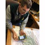 Todd Bennington | Twin Harbors Newspaper Group                                Montesano City Forester Loren Hiner demonstrates the use of a mobile application that will help the public navigate recreational trails more safely.