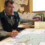(Todd Bennington | Twin Harbors Newspaper Group) Montesano City Forester Loren Hiner shows a copy of a map that will be placed on recreational trails as a means of helping the public navigate them more easily.