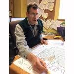 (Todd Bennington | Twin Harbors Newspaper Group) Montesano City Forester Loren Hiner shows a copy of a map that will be placed on recreational trails as a means of helping the public navigate them more easily.