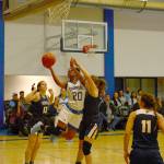 Alexia Thrower finishes through contact against Linn-Benton on Saturday. Thrower finished with 25 points in the contest.