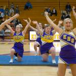 Mark Hoffman | Milwaukee Journal Sentinel                                 Sparkle cheerleaders Matilda Gillard (center left) and Victoria Loyo (center right) are framed by varsity cheerleaders Hailey Fortier (left) and Jodie Gurda (right) on Dec. 12 at New Berlin Eisenhower High School in New Berlin, Wisconsin.