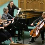 Photo by Keith J. Krueger                                Violinist Karen Meikle, pianist Merry Jo Zimmer and cellist Jenny Leighton perform at Musicale 2013, aided by Kari Hasbrouck.