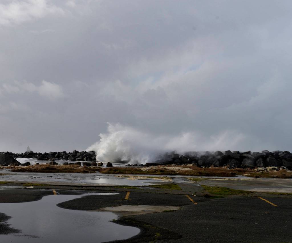 DAN HAMMOCK | THE DAILY WORLD                                 Waves tumble over the top of the Westport jetty, just west of the observation tower.
