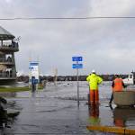 DAN HAMMOCK | THE DAILY WORLD                                Waves pummeling the Westport jetty Thursday caused flooding on several blocks of Westhaven Drive.