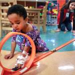 Brian Peterson | Star Tribune                                 Child Life volunteer Yesica Mercado Munoz, 16, plays with 2-year-old Damian Bridges at Childrens Hospital in St. Paul, Minnesota.