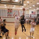Aberdeens Ben Dublanko soars to put up a shot over Hoquiams Matt Brown. (Brendan Carl Photography)