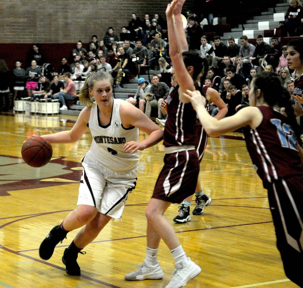 Montesanos Zoe Hutchings drives to the basket in the first quarter of a 1A District tournament game against Stevenson. Montesano won, 66-19.