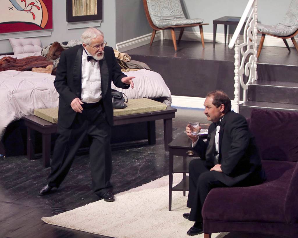 (Photo by Keith J. Krueger) Ira Drew (David Foscue, left) discusses the merits of being a theater critic with James Wicker (Jeff Ryser).