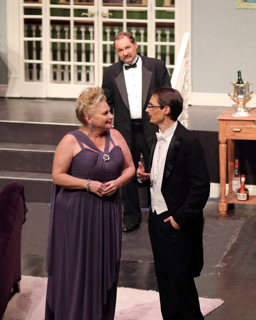 (Photo by Keith J. Krueger) Producer Julia Budder (Valerie Parker) talks with playwright Peter Austin (Cliff Green) as James Wicker (Jeff Ryser) looks on.
