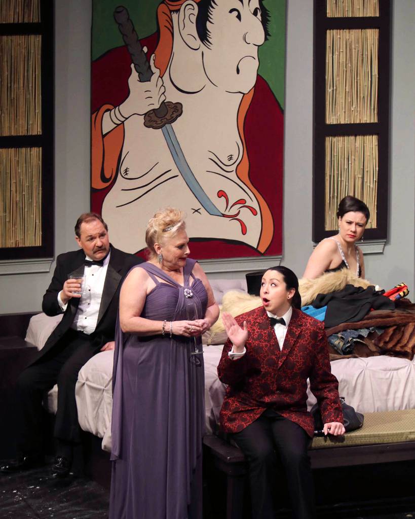 (Photo by Keith J. Krueger) From left: Julia Budder, James Wicker and Virginia Noyes (Valerie Parker, Jeff Ryser and Sara Henry) listen as director Frankie Finger (Angel Howard, red jacket) talks about her past successes and failures.