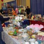 (File photo) Shoppers browse booths at last years Renewed Antiques Show at the Ocean Shores Convention Center.