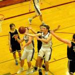 Sam Winter drives to the rim in a district tournament game against Forks.