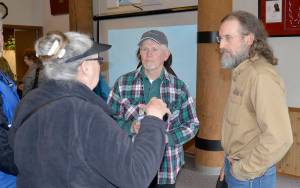 DAN HAMMOCK | THE DAILY WORLD                                Pacific County Drainage District #1 boar chairman David Cottrell (right) speaks with property owners along the north Willapa Harbor shoreline after a meeting discussing the timeline of shoreline protection efforts to fight erosion over the next year.