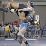 Elmas Justin Sample lifts Royals Benjamin Bustos off the mat in his 5-0 victory in the first round of the Mat Classic on Friday. (Brendan Carl Photography)