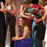 Photo by Keith J. Krueger                                2017 Outstanding Teen Paicyn Dragoo places the crown on 2018 winner Mercedes Morrill at the annual pageant.