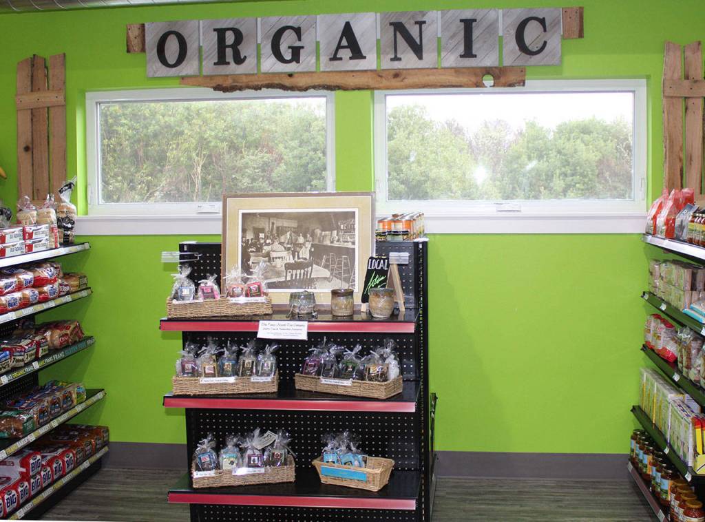 Carlos Villarreal made the signs from the wooden crates and pallet boards that contained the equipment needed for the new Fresh Market.