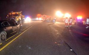 WASHINGTON STATE PATROL Photo                                First responders surround a 1991 Acura at the scene of a fatal accident on State Route 12 early Sunday morning. The entire roadway was blocked for more than seven hours during the initial investigation.