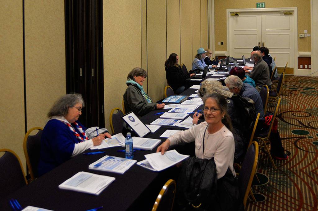 LOUIS KRAUSS | THE DAILY WORLD Attendees at Mondays BOEM workshop fill out feedback forms regarding the Trump administrations plan to open U.S. offshore land for oil drilling.