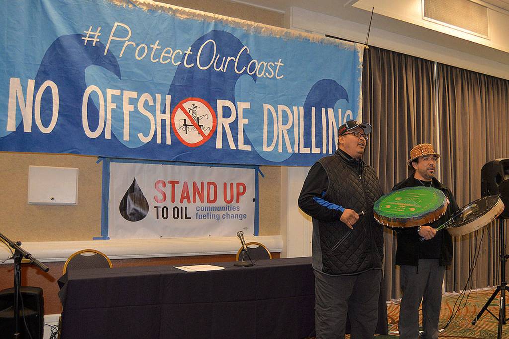 LOUIS KRAUSS | THE DAILY WORLD Willie Frank III and Hweqwidi Hanford Mccloud, both from the Nisqually Tribe, perform a song at Mondays event in Olympia to oppose offshore drilling.