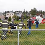 DAN HAMMOCK | THE DAILY WORLD                                Aberdeen Fire Department personnel meet a helicopter crew from Airlift Northwest as part of the Every 32 minutes program at Aberdeen High School. The helicopter landed in the soccer field adjacent to the high school parking lot and took a student who was playing a critically injured accident victim.