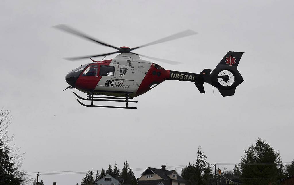 DAN HAMMOCK | THE DAILY WORLD                                A helicopter from Northwest Airlift takes off from the soccer field near Aberdeen High School Monday morning. Just prior an Aberdeen student playing the role of a seriously injured car crash was placed aboard, part of the Every 32 Minutes program to teach young people about the impact of impaired driving.