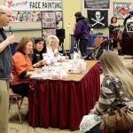 Judges sample the chowders entered in the 2017 contest at the annual Razor Clam Festival and Seafood Extravaganza at the Ocean Shores Convention Center, with emcee Johnny Manson.