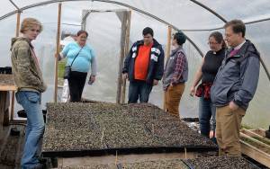 DAN HAMMOCK | THE DAILY WORLD                                Harbor Roots Farm, a 3-acre vegetable and herb garden in the Wynooche Valley, will break ground Tuesday. Three apprentices have been hired for the season. Here the group looks over the starts in a greenhouse adjacent to the farm. From left: Nita Cross, Janet Belles, James Petersen-Yeager, Hannah Jones, Reverend Sarah Monroe and Bishop Greg Rickel.