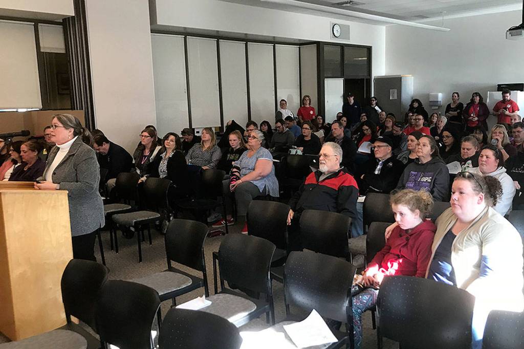 LOUIS KRAUSS | THE DAILY WORLD Community members listen to Superintendent Alicia Henderson discuss the options to reduce K-3 class sizes at Tuesdays Aberdeen School Board meeting.