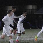 Aberdeens Hulizes Chavez, No. 9 in center, celebrates with his teammates after scoring the game-winning goal against Hoquiam on Thursday night at rain-swept Stewart Field. (Hasani Grayson | The Daily World)