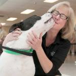(Courtesy Marcy Merrill) PAWS board memeber Linda Francisco poses with Max at the Freedom Trails ceremony last week at Stafford Creek Corrections Center. Max was trained by inmates over the last 10 weeks to perform seven basic commands.